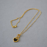 Gold Heart Pendant Necklace with Black and White Design