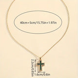 Elegant Gold Necklace Featuring a Majestic Emerald Cross Pendant