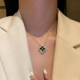 Gold Necklace with Shimmering Emerald Clover Pendant