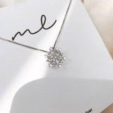 Gold and Silver Crystal Necklace Adorned with Sparkling Snowflakes