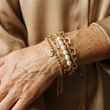 Pearl-Embellished Gold Bracelets