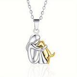 Embraced Girl and Dog Pendant Necklace