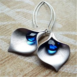 Silver Lotus Earrings with Blue Crystal Accents