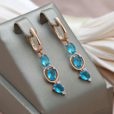 Stunning Gold Earrings Adorned with Blue Crystals