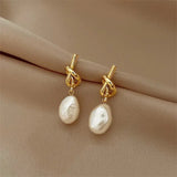 Gold Elegance: Baroque Pearl Earrings