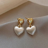 Chic Heart-Shaped Earrings Adorned with Golden Pearls